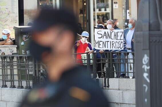 מחאה נגד הסגר במדריד // צילום: איי.פי